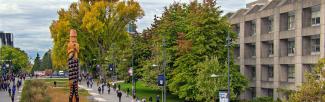 The entrance to UBC with the xʷməθkʷəy̓əm welcome post
